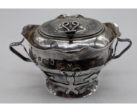 An Art Nouveau silver caddy, twin handled, hallmarked Birmingham, 1903, maker Williams (Birmingham) Ltd, 215g, H.8.5cm