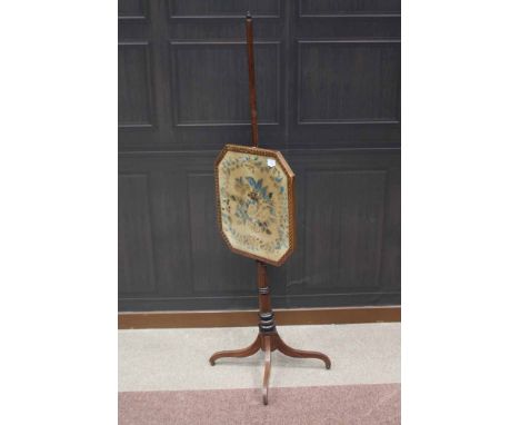 REGENCY MAHOGANY POLE SCREENthe octagonal shaped banner inset with floral decorated velvet panel, on turned ringed pillar wit