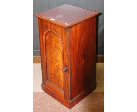 VICTORIAN MAHOGANY BEDSIDE CABINETof tapering form, enclosed by a single arch moulded panel door on a box base, 36cm wide
