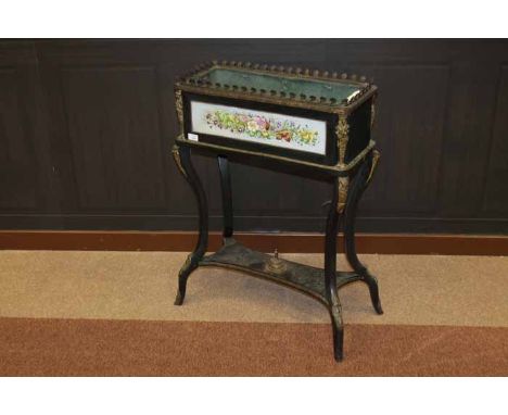 VICTORIAN EBONISED AND GILT METAL MOUNTED OBLONG PLANTER with lift out liner, the front inlaid with floral inlaid ceramic pan