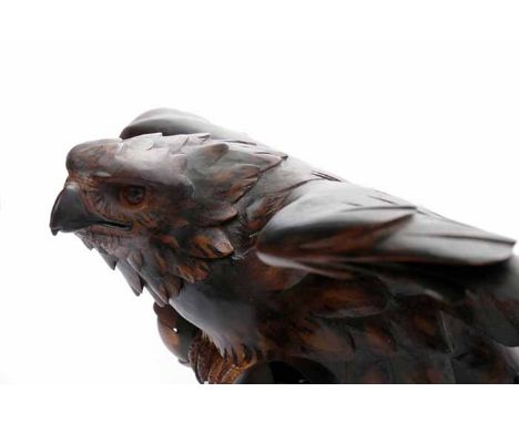 UNUSUAL EARLY 20TH CENTURY OVERHEAD LIGHT FITTINGcarved in wood in the form of an eagle, 71.5cm wide 