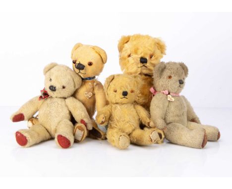 Five post-war Chad Valley teddy bears,  three with golden mohair, and foot pad labels --15in. (38cm.) high (one worn, others 