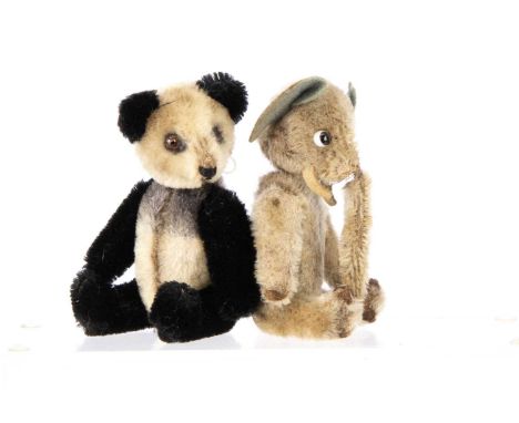 A Schuco Yes /No panda bear,  with white and black mohair, clear and black glass eye with painted back (one missing) --5 1/4i