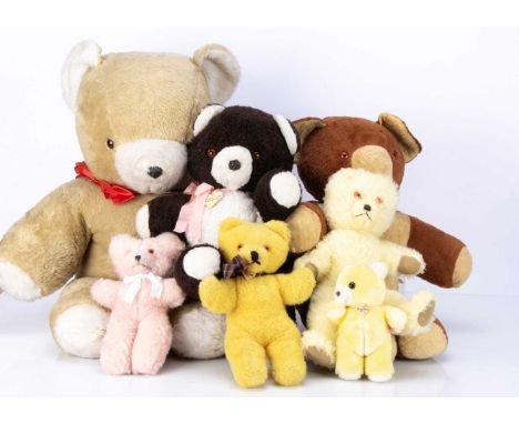 Fourteen vintage unjointed teddy bears, including a large light brown bear with white muzzle, inner ear and pads --31in. (79c