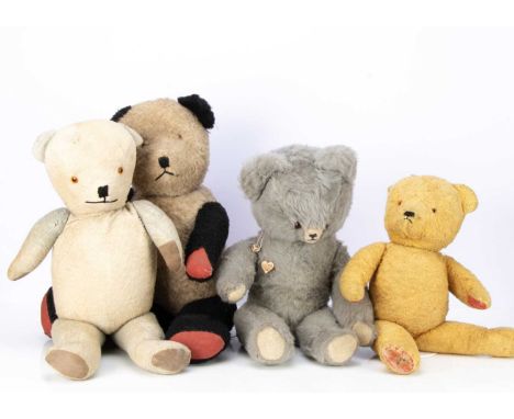 Eight large manufactured vintage teddy bears including a light and darker blue panda, a golden mohair, a grey long plush bear