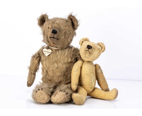 Two 1920 /1930s British teddy bears,  an unjointed Omega bear with blonde mohair, pronounced muzzle, black stitched nose and 