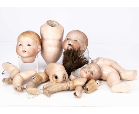 Two dolls for restoration,  comprising of a Bruno Schmidt 2097 character baby, with brown wig, composition body and jointed l