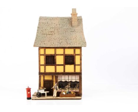 A Jim Hemsley Tigger Pond 1/24th scale  modern miniaturist wall mounted dolls’ house cake shop, front opening to reveal two r