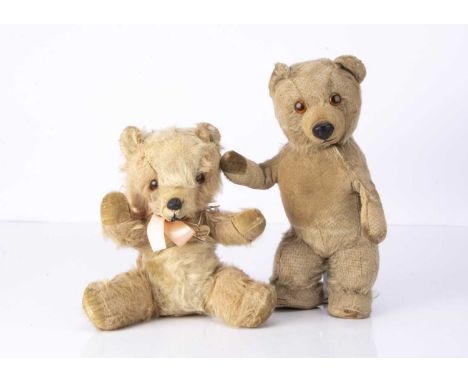 Two post war Chiltern teddy bears,  including a 1950s musical Chiltern Bruin teddy bear, with remains of light brown and whit