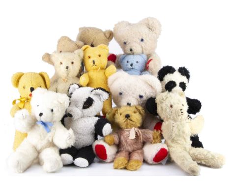 Thirteen vintage unjointed teddy bears,  including three Wendy Boston bears, with labels to legs, a light brown bear with rem