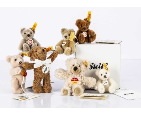 Seven small Steiff yellow tag teddy bears,  including a pink Original teddy --4 1/2in. (11cm.) high; a light brown Classic be