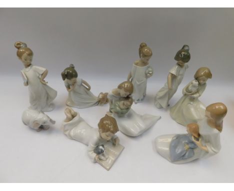 A collection of nine boxed Nao pottery figures, including young girls and boys, an Elephant and others. All boxes in one box.