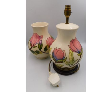 A Moorcroft vase in the Magnolia design by Walter Moorcroft c1980, approximate height 23.5cm with a Magnolia design lamp of t
