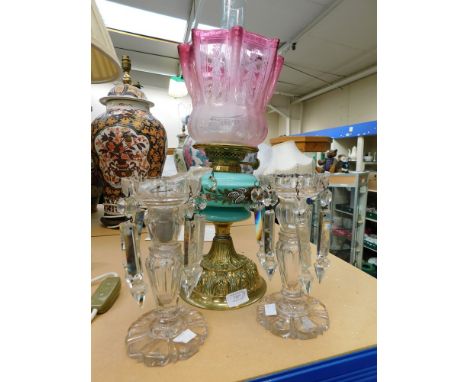 An oil lamp with green glass chamber and cranberry glass shade, together with a pair of A/F lustres.