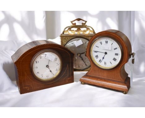 Two early 20th Century mahogany mantle clocks along with a 1950s brass mantle clock.