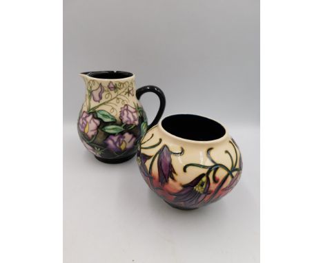 A Moorcroft jug in the Day Dream design by Sian Leeper approximate height 14.5cm together with a vase in the pasque design by