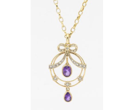 An Edwardian style amethyst 9ct gold drop pendant, comprising a diamond set bow top, suspending an oval mixed cut amethyst, t