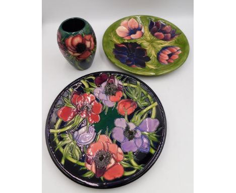 2 Moorcroft pieces in the Anemone tribute design by Emma Bossons , to include a vase , approximate height 13cm , seconds(red 