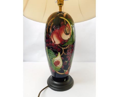 A Moorcroft lamp in the Queens Choice design by Emma Bossons with shade, ceramic portion approximate height 30cm , 1st Qualit
