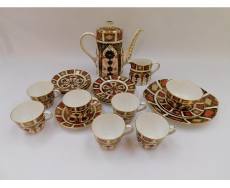 A collection of Royal Crown Derby 1128 pattern to include Coffee Pot, Sugar &amp; Cream Jug , 6 cups (1 factory second) 5 sau