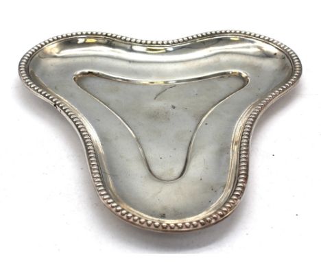 A Victorian silver abstractly shaped trinket dish / tray, with beaded rim, hallmarked by Robert Garrard II, London, 1868, app