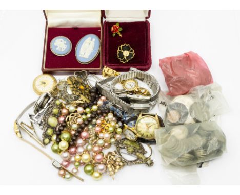 A collection of costume jewellery to include two silver mounted Wedgwood brooches, along with paste set brooches, gilt metal 