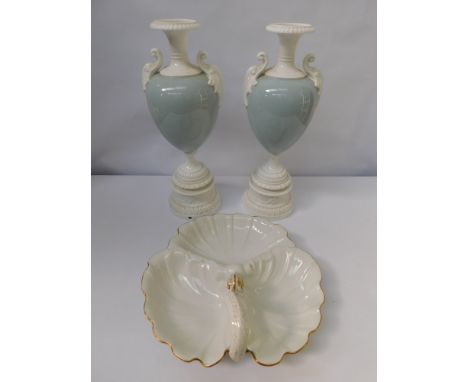A pair of 20th century Royal Worcester 1969 numbered decorative urns, factory converted to lamp bases, in plain white and blu