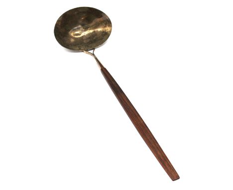 An Elizabeth II Modernist silver oval shaped planished ladle, with rosewood handle, hallmarked by Keith H Smith, London, 1971