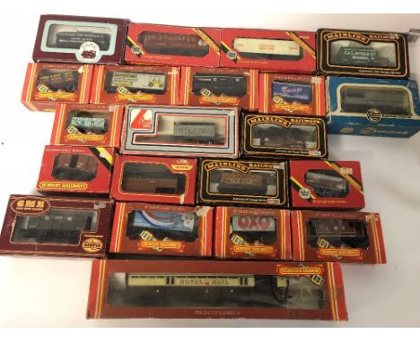 Assorted Hornby / Mainline etc OO gauge freight wagons includes a GWR Royal Mail coach