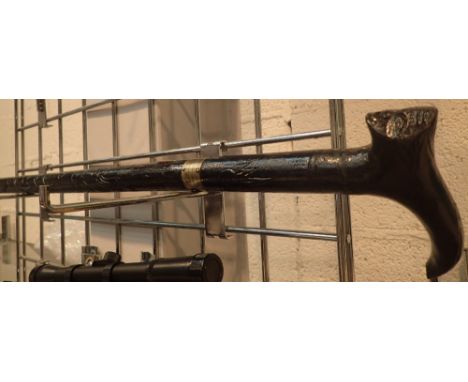 Ebonised antique swordstick with carved decoration