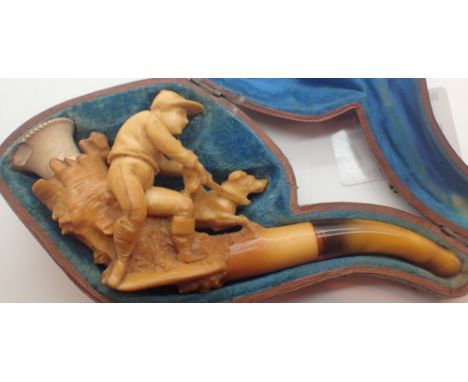Cased meerschaum pipe depicting man with dog 