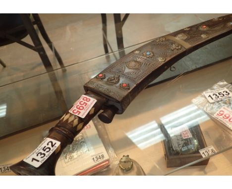 Decorative wall hanger kukri with wooden sheath and skinning knives CONDITION REPORT: The item is larger than avarage with a 