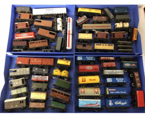 OO gauge in excess of sixty assorted unboxed freight wagons including Hornby among others