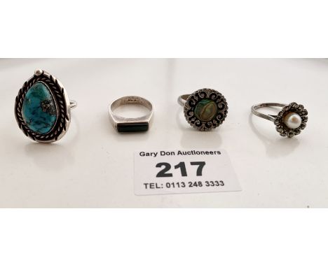 3 silver rings with stones and 1 dress ring