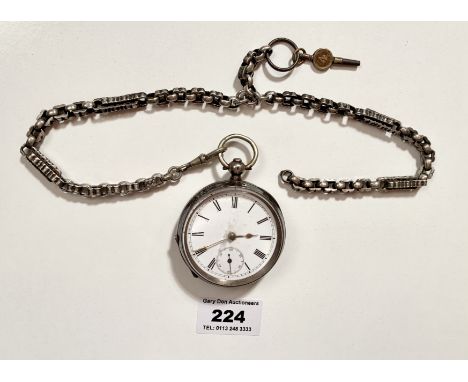 Silver pocket watch on plated chain, 2” (5cm) diameter face. Winds and runs.