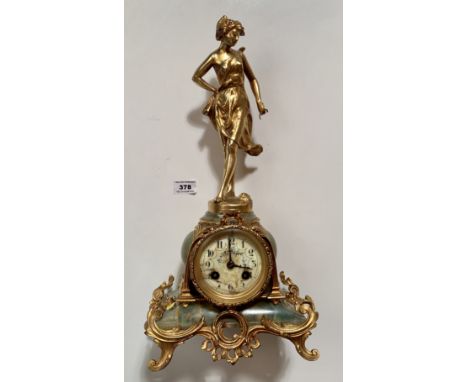 Gilt and onyx mantle clock marked  “Medaille D’Argent” with pendulum and figure on top marked Ferrand, France, 17” (43cm) hig