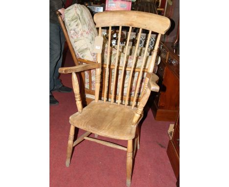 An early 20th century elm and beech stick back farmhouse open armchair, width 58cm