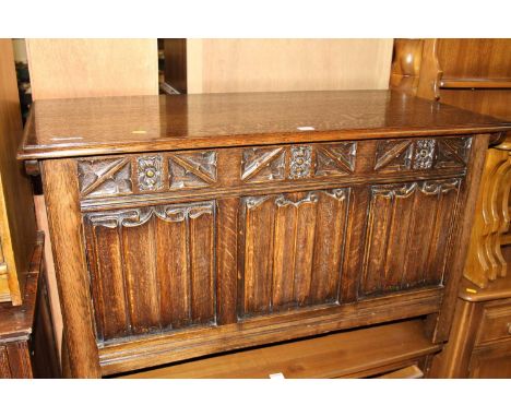 A joined oak linenfold three panelled hinge topped coffer, in the Gothic taste, w.106.5cmWidth 107cm, depth 50, height 61cm.O