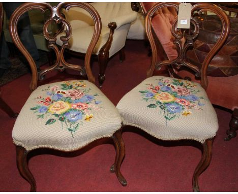 A pair of mid-Victorian walnut balloon back salon side chairs, having tapestry upholstered stuff over seats, together with tw