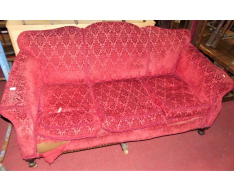 An early 20th century mahogany framed and red floral velour upholstered three-seater sofa, w.195cm
