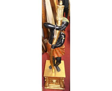 A contemporary painted and gilt decorated freestanding blackamore floor light, raised on pedestal, h.157cm
