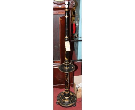 A chinoiserie black lacquered and gilt decorated standard lamp, having circular central platform, h.152cm