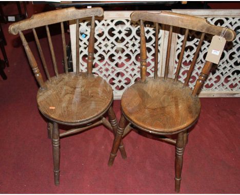 A set of four early 20th century elm and beech stick back pub chairs