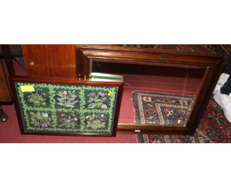 An oak rectangular bevelled framed wall mirror, 56.5 x 71.5cm, together with a tapestry inset wall panel (2)