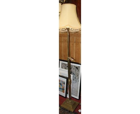 An early 20th century reeded brass standard lamp, with telescopic action and raised on square stepped baseheight 204cm, base 
