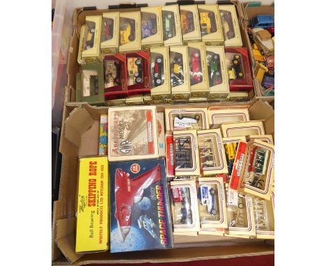 Two trays containing mixed modern release diecast vehicles and postcards, modern release collectables to include a Space Thun