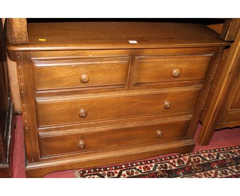 An Ercol mid-elm 'Golden Dawn' low chest of two short over two long drawers, w.100cm