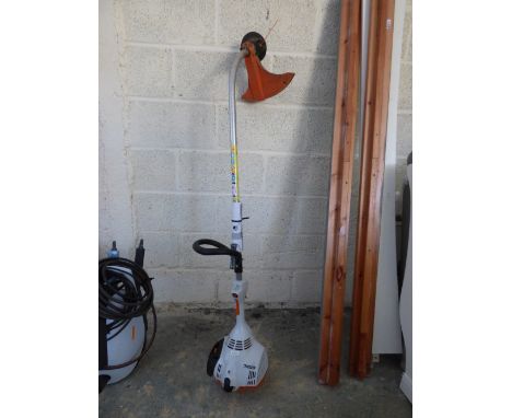 Petrol engine strimmer, with instructions, by Stihl FS40