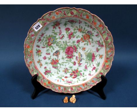 A Late XIX Century Canton Porcelain Dish, of circular form with shaped outcurved rim, painted in multi-coloured enamels with 