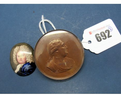 An Enamelled Oval Portrait Miniature, possibly depicting George Frederick Handel, 3.8 x 3.1cms; A Copper Medal to Charles Jam